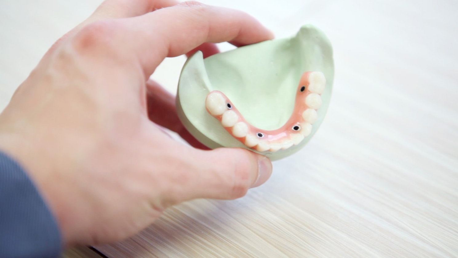 implant secured dentures in manchester