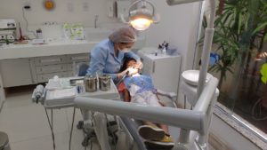 dentist with a dental implant patient