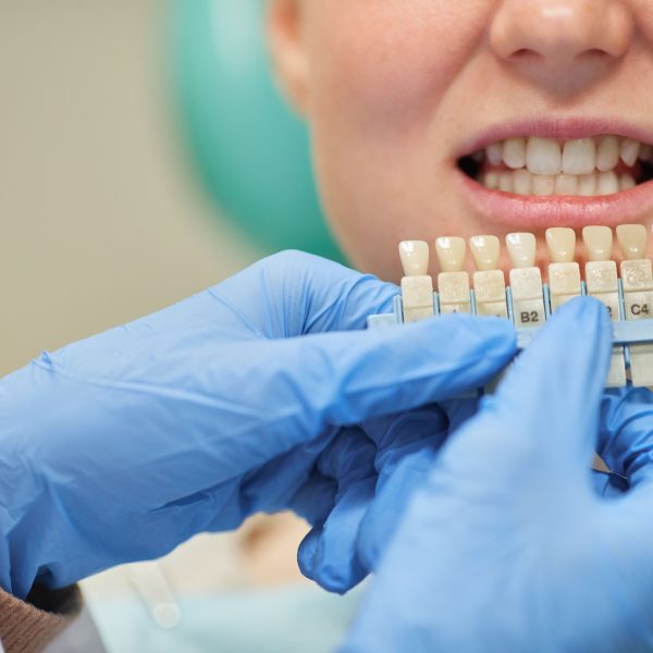 doctor showing patient tooth implant