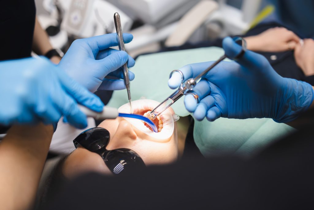 Doctor giving anaesthesia to patient before oral surgery